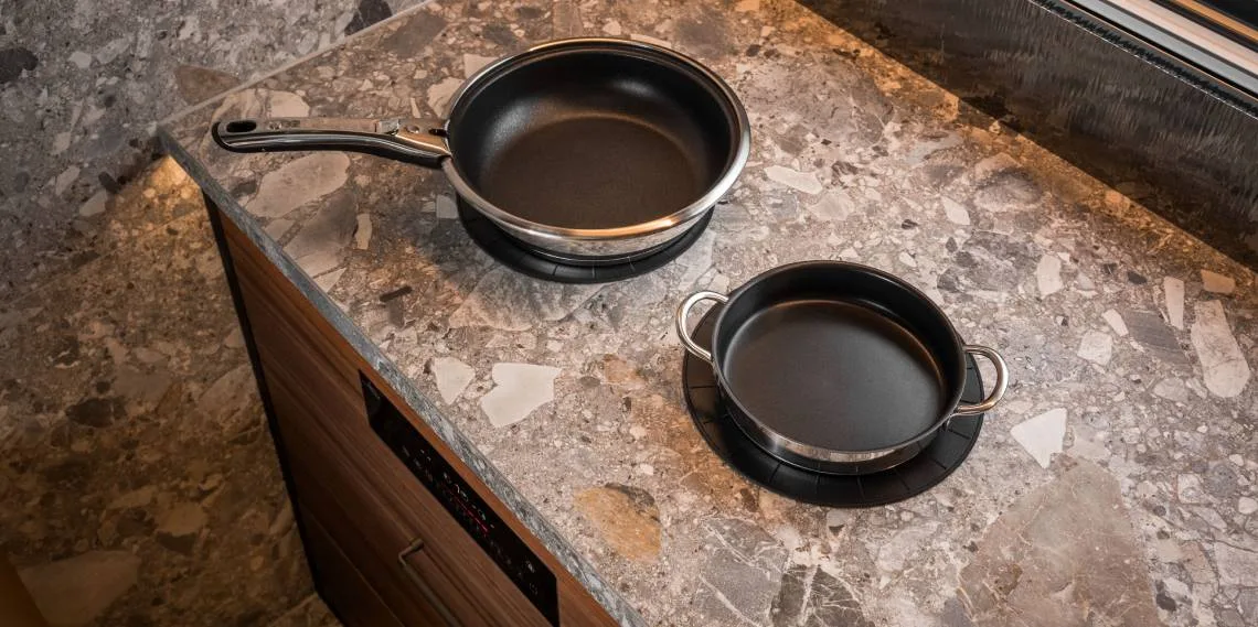 Cookware placed directly on an Invisacook-enabled stone countertop